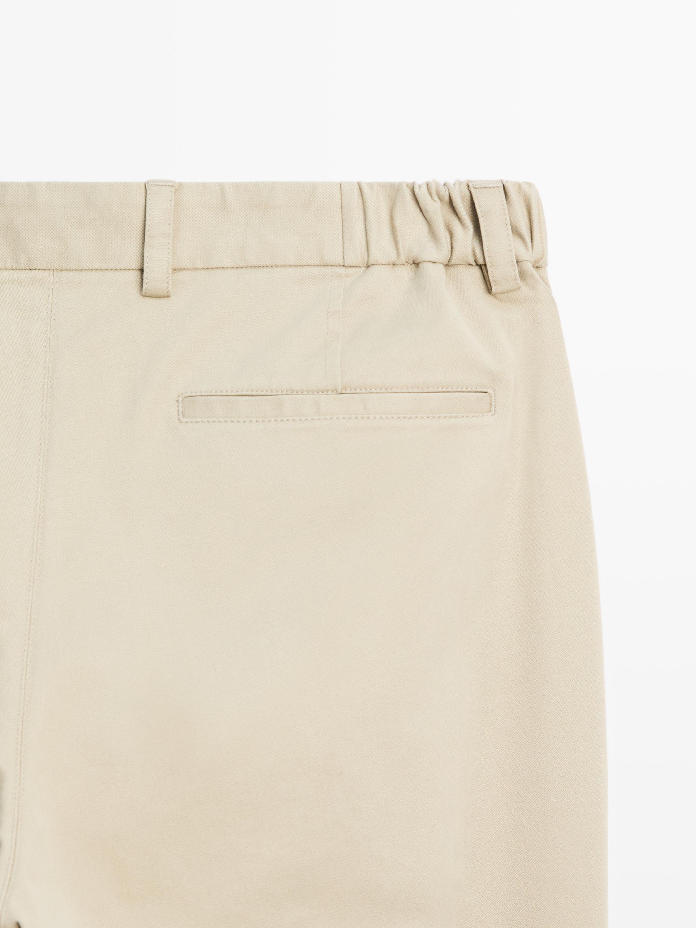 Slim fit trousers with elastic side detail